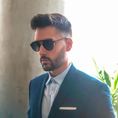 man in business suit wearing johnny shades sunglasses