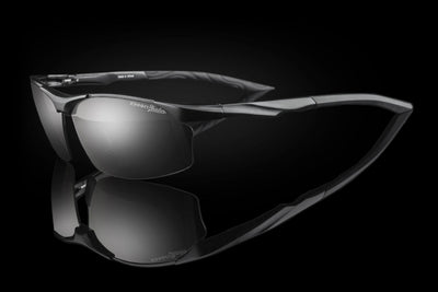 Black sunglasses with reflective lenses on a black background