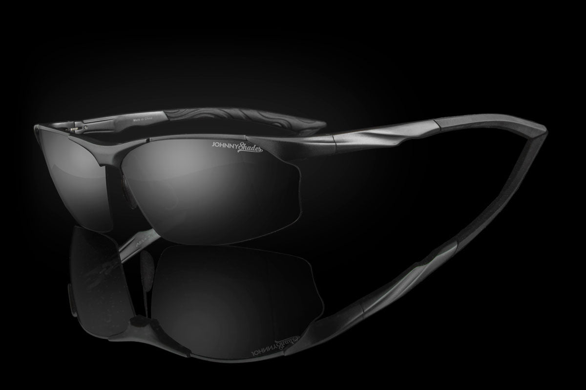 Gunmetal sunglasses with a reflective surface on a black background